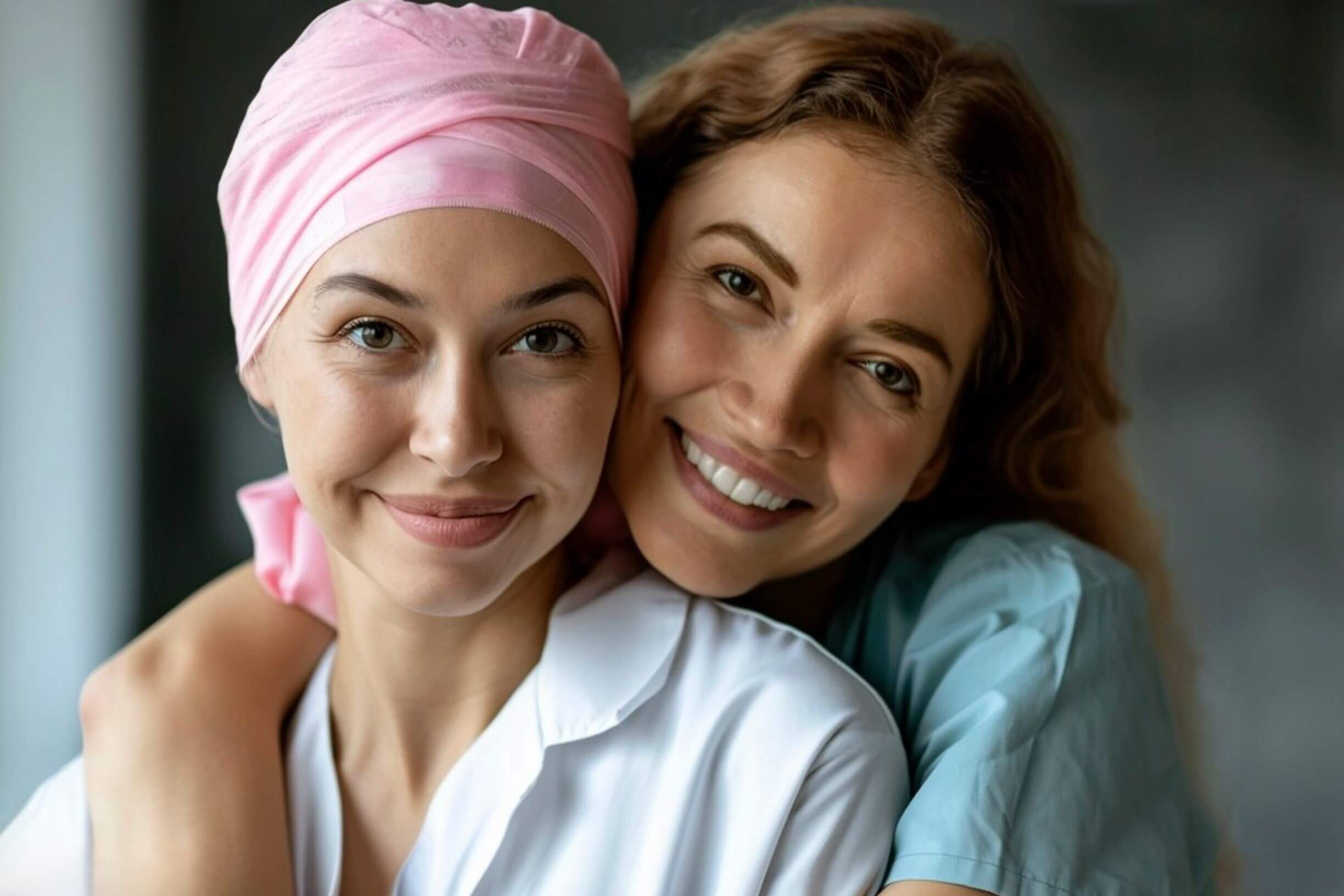 Two people hugging, representing cancer survivorship and support