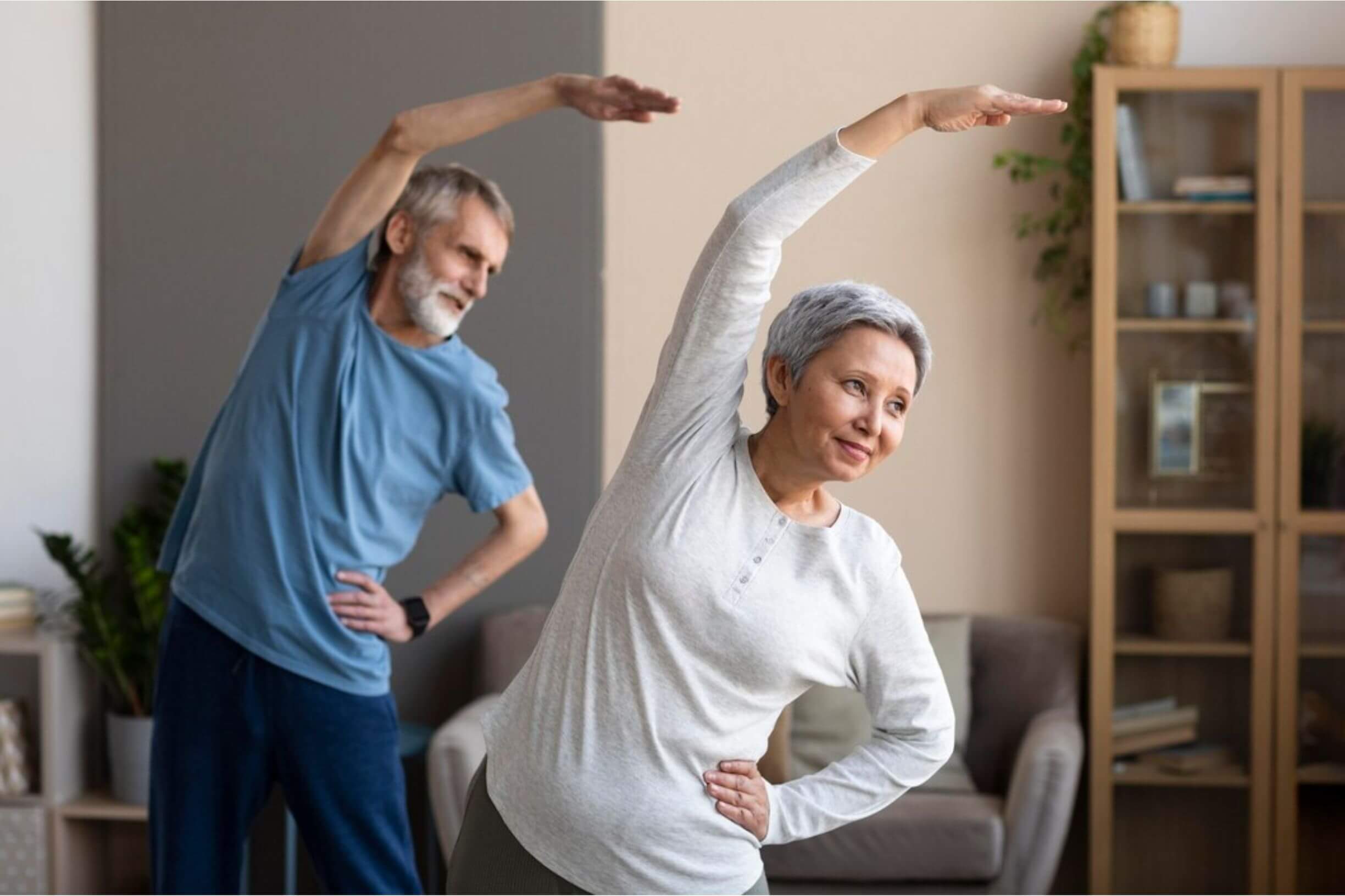 Two people exercising as part of cancer rehabilitation therapy