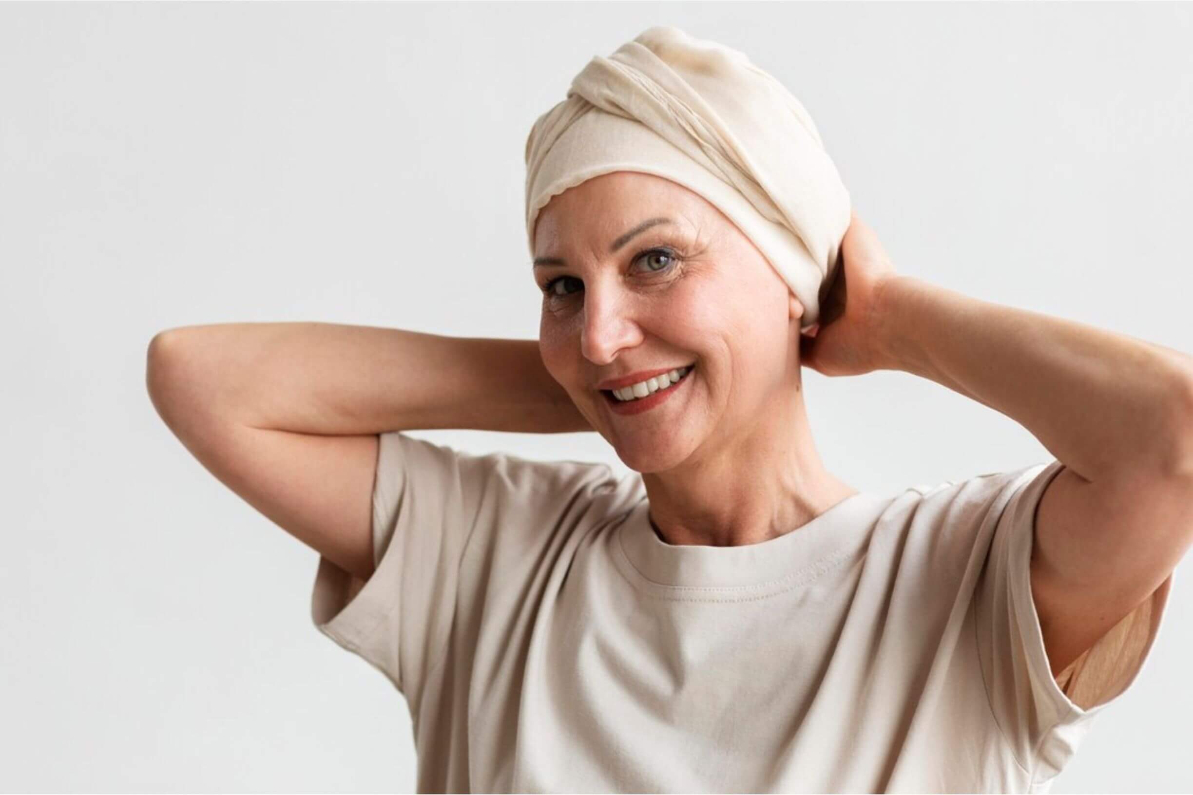 Smiling woman, embodying happiness and resilience in cancer survivorship