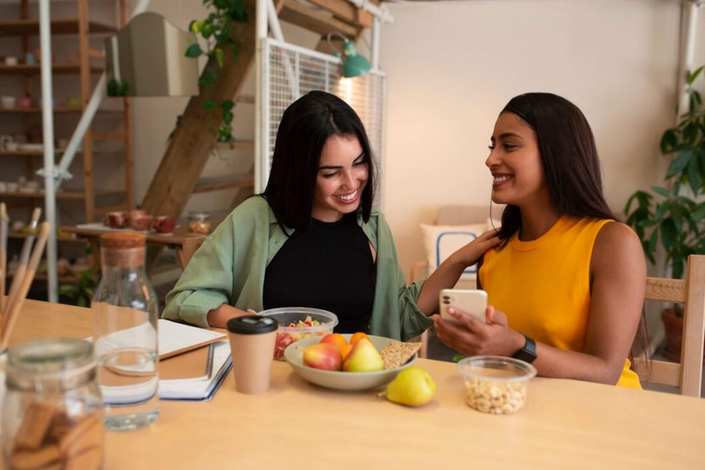 Two women enjoying a healthy meal and conversation